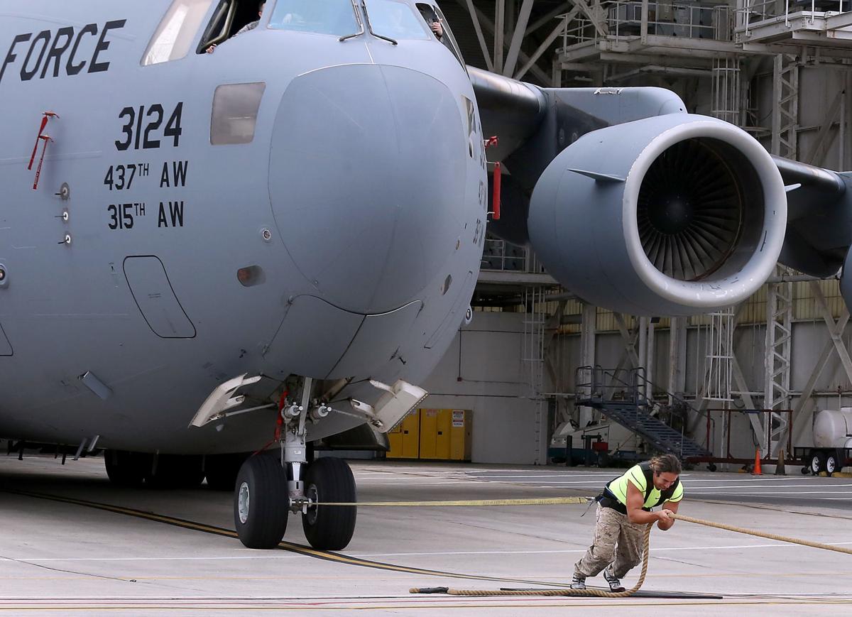 Here are Videos of Man Pulling a 416,299 lb C-17 Globemaster III Aircraft to make World record